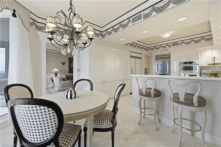 Dining space featuring a chandelier and light tile patterned floors