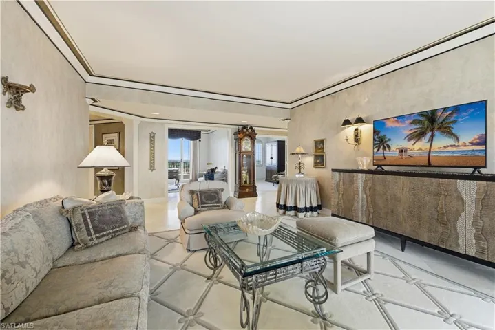 Tiled living room featuring ornate columns