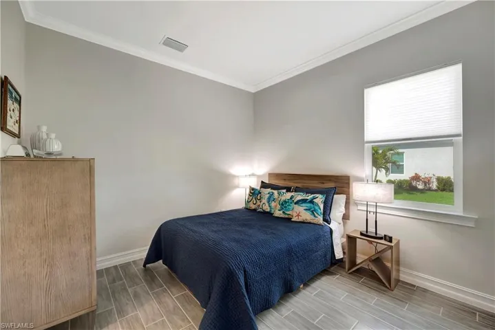 Bedroom with ornamental molding