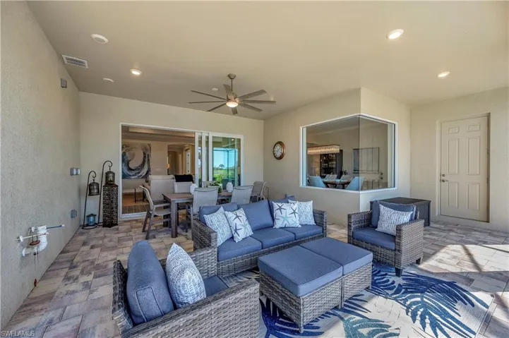 View of patio / terrace with an outdoor living space and ceiling fan