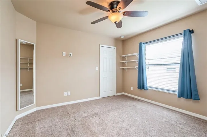 Back Bedroom with wall-mounted mirror/jewelry hanger