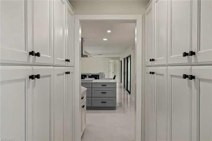 Large custom pantry looking into the kitchen