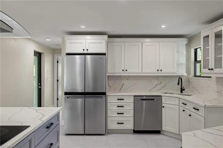 Kitchen with Quartz countertops, appliances with stainless steel finishes,  and corner sink with a view!