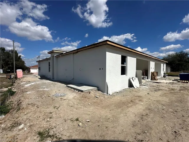 Back of property with stucco siding