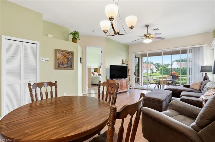 Dining room with a chandelier and a ceiling fan