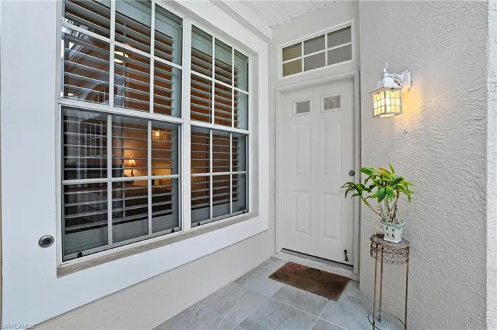 Property entrance with stucco siding