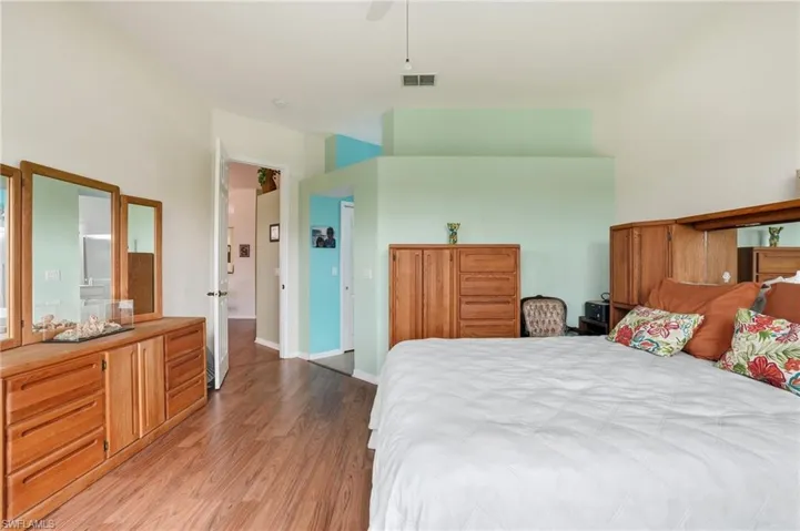 Bedroom featuring light wood-style floors and a ceiling fan