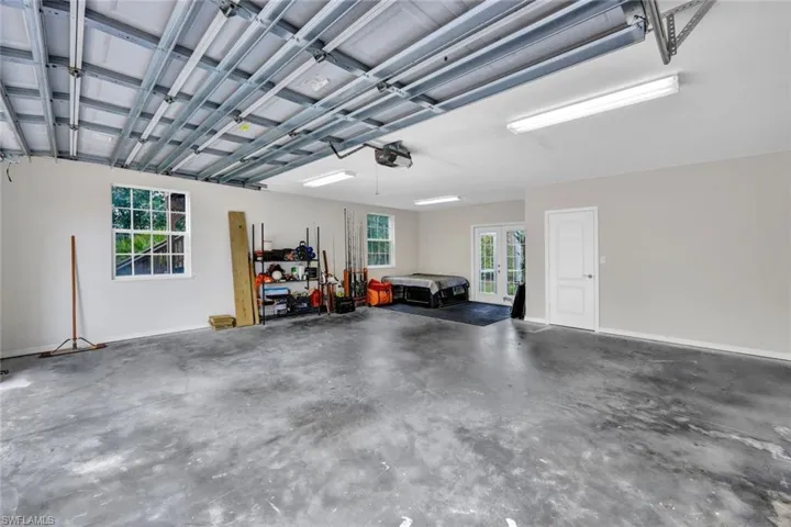 Garage featuring a garage door opener