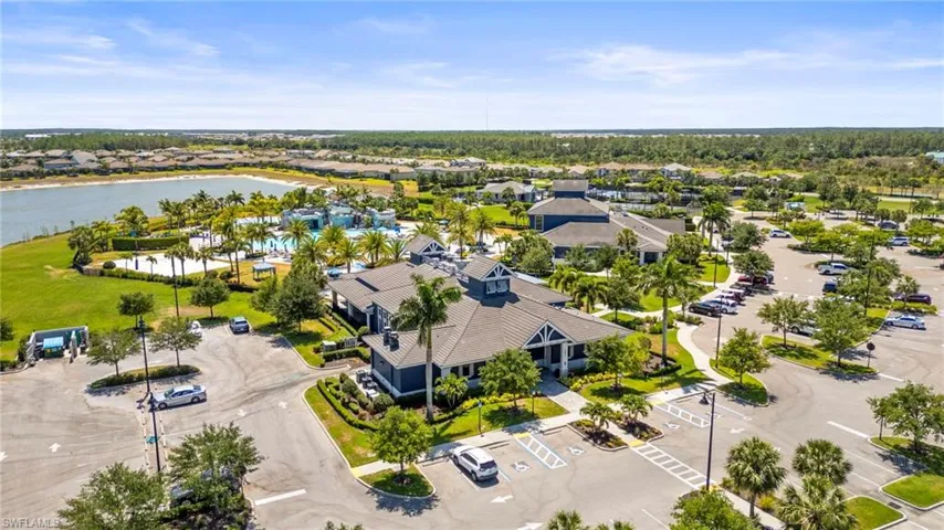 Aerial view of residential area featuring a large body of water
