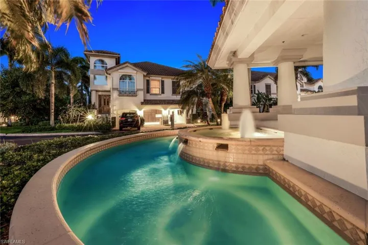 View of swimming pool with a pool with connected hot tub and a patio area