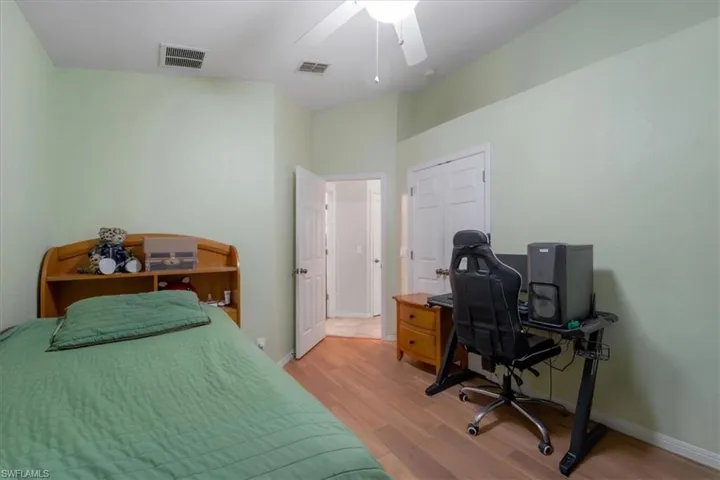 Bedroom featuring light hardwood / wood-style flooring and ceiling fan