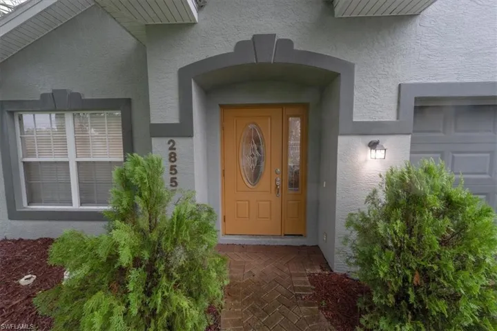 Property entrance with a garage
