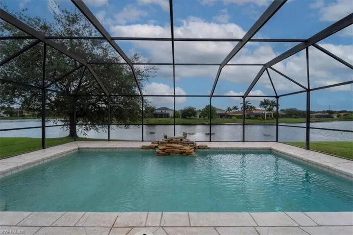 View of pool featuring a lanai