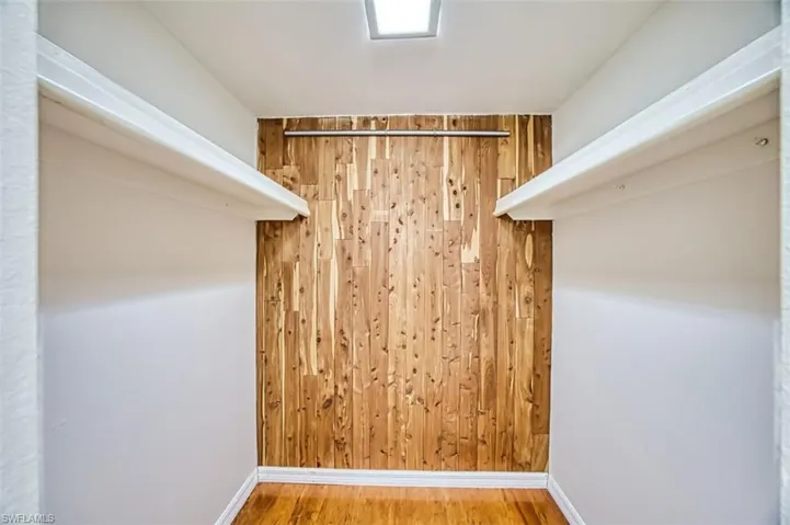 Spacious closet featuring wood finished floors