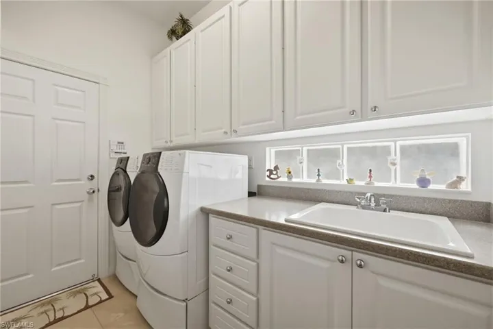 Laundry Room with Washer, Dryer and Sink