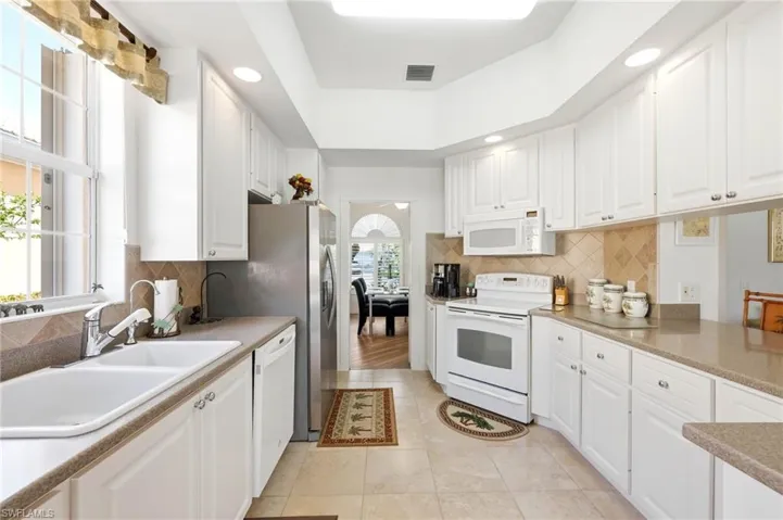 Open Kitchen with white/stainless steel appliances