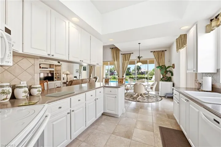 View from Kitchen to Dining area and Pool Deck