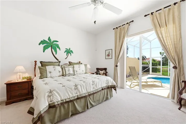 Master Bedroom with access to the fully screened-in Pool Deck