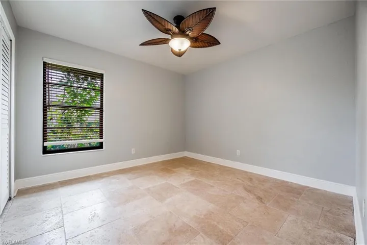 Empty room featuring ceiling fan