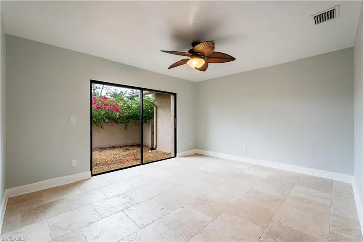 Empty room featuring ceiling fan