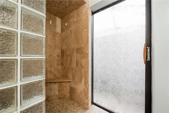 Bathroom featuring tiled shower