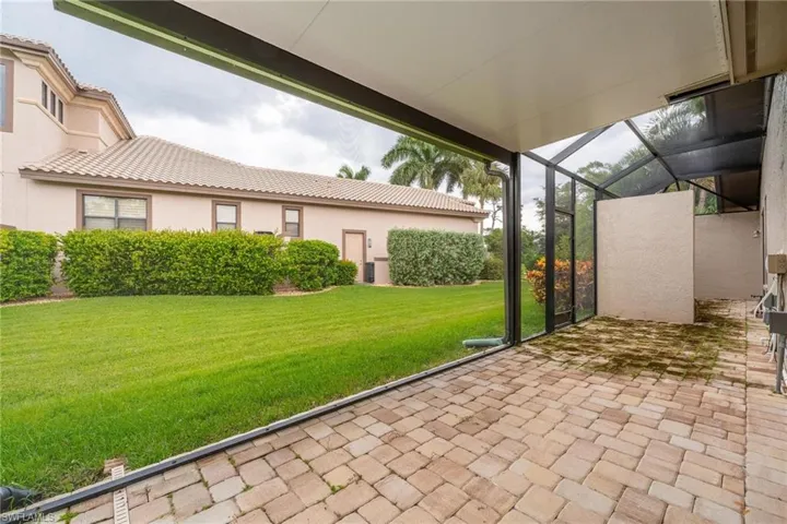 View of patio / terrace featuring a lanai