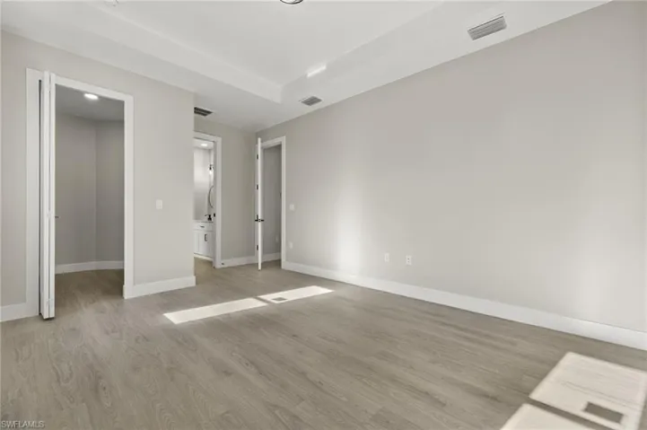 Unfurnished bedroom featuring light wood-type flooring
