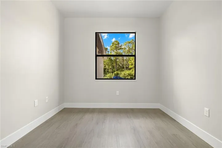 Empty room featuring light wood-type flooring