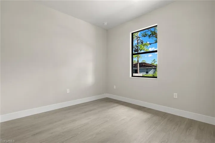 Spare room with light wood-type flooring