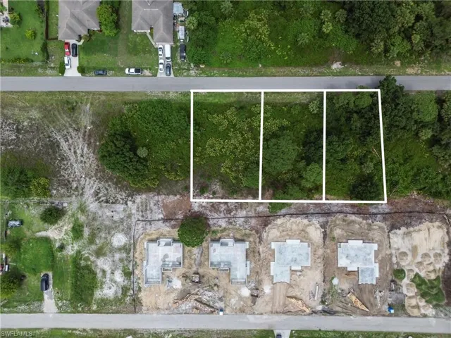 Aerial perspective of suburban area with property parcel outlined