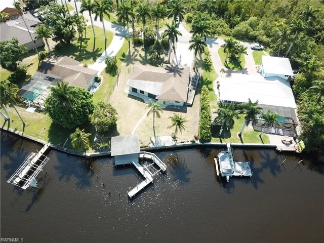 View of property location featuring a nearby body of water and nearby suburban area