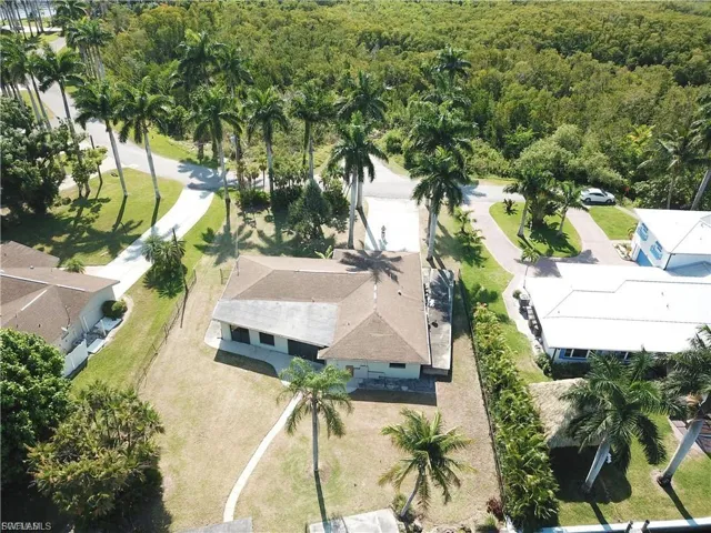 View from above of property featuring a heavily wooded area