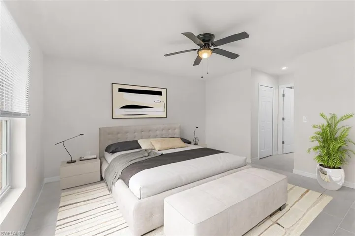 Bedroom featuring ceiling fan and a closet