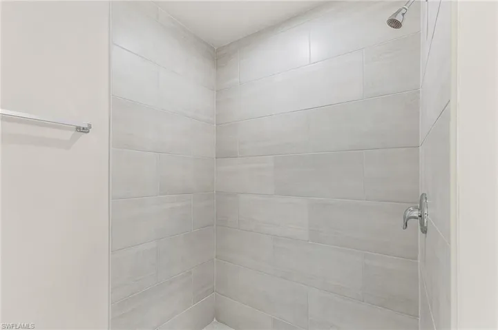 Bathroom featuring a tile shower