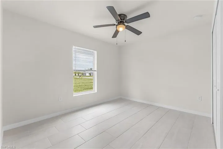 Spare room with ceiling fan