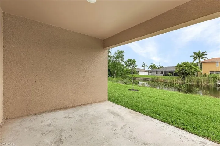View of patio with a water view
