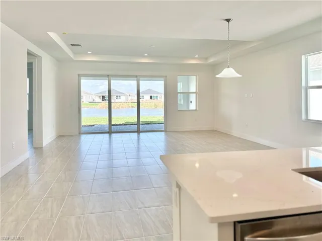 Gorgeous, open-concept kitchen with beautiful water views of community interior pond