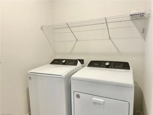 Laundry room with washer and gas dryer