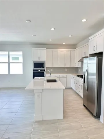 Kitchen layout with stainless steel kitchen appliances