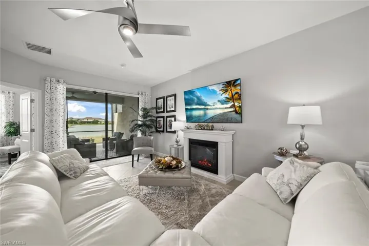Electric fireplace, sliders to lanai let the natural light stream in
