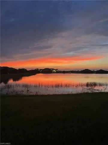 Stunning sunsets afterglow paints the sky as you look out over the lake