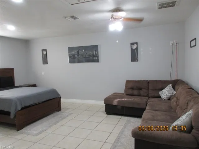 Bedroom featuring ceiling fan and light tile patterned floors