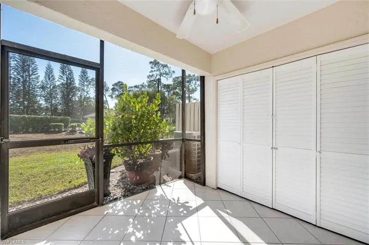 Unfurnished sunroom with ceiling fan