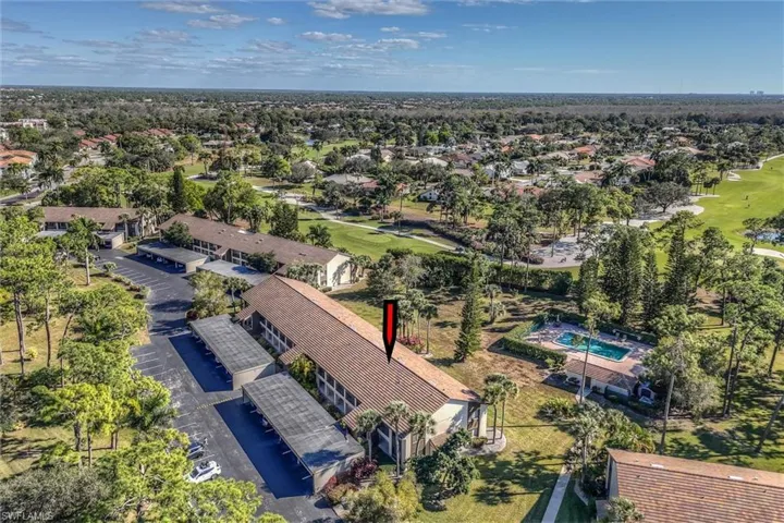 Aerial view of property's location featuring a local golf course