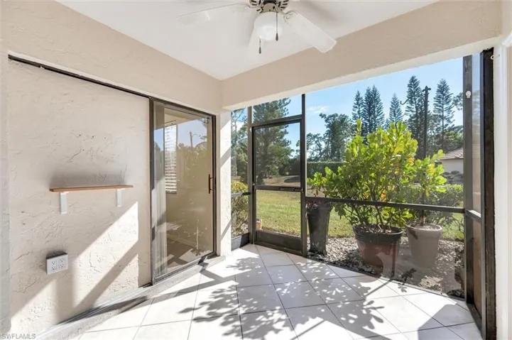 Sunroom featuring a ceiling fan and plenty of natural light