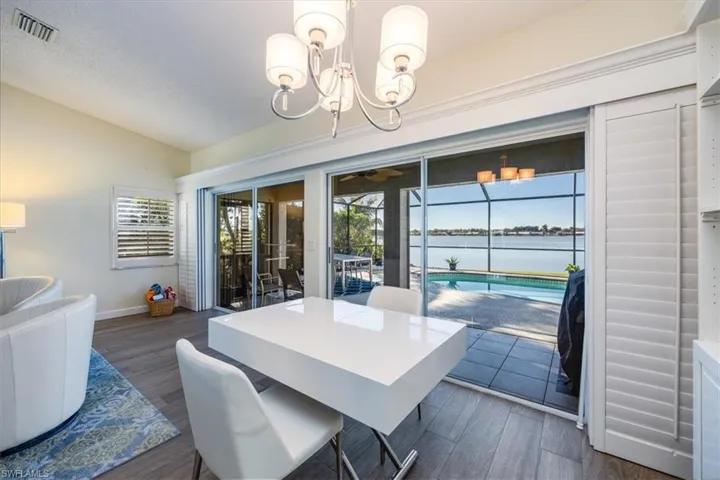 Enjoy the lake and pool views while dining