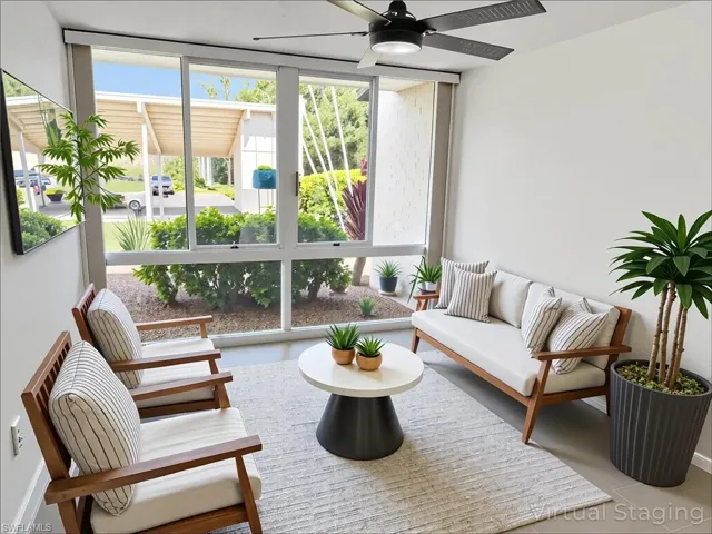 Sunroom with floor to ceiling windows and healthy amount of natural light