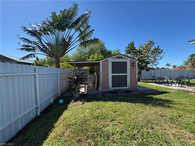 View of shed featuring a fenced backyard