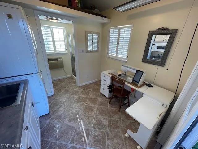 Home office with a wall unit AC and sink
