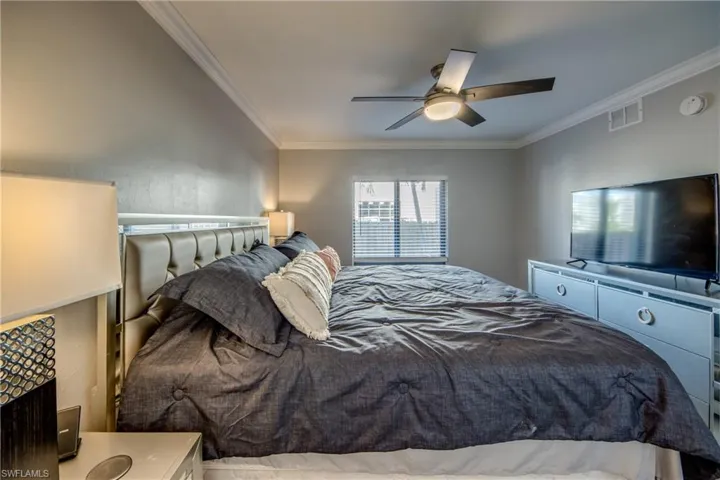 Bedroom featuring crown molding and ceiling fan